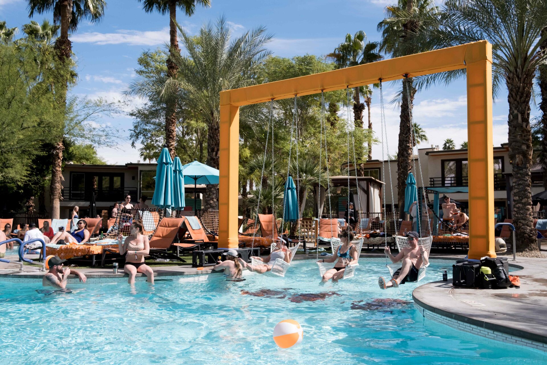 Guests enjoying the water and sun with custom built swing sets