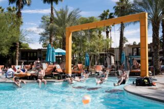 Guests enjoying the water and sun with custom built swing sets