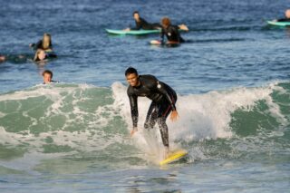 A man surfing a wave in Orange County