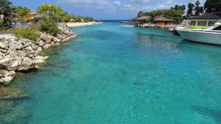 Catamaran on clear blue green waters