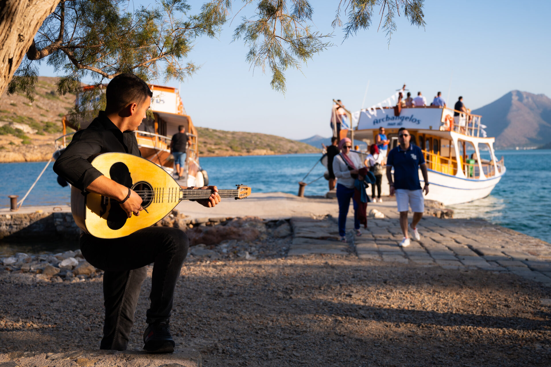 Guests greeted with entertainment as they come off a boat ride.