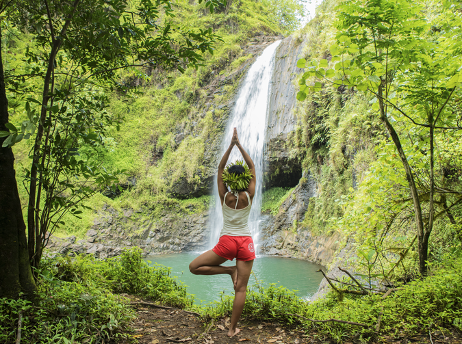 wellness by a waterfall