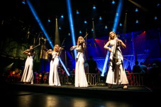 4 violinists playing at the Dolby Theatre