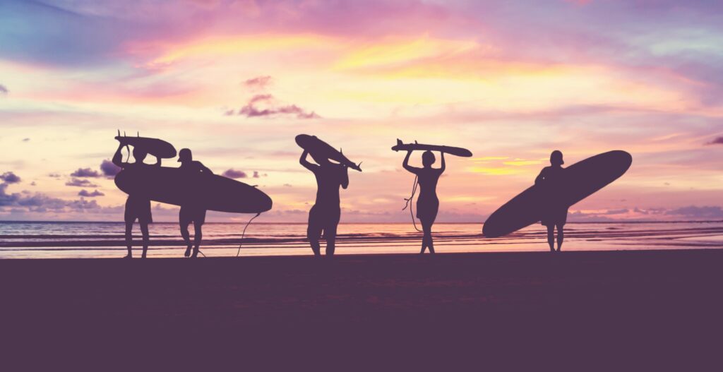 Surfers on the beach.