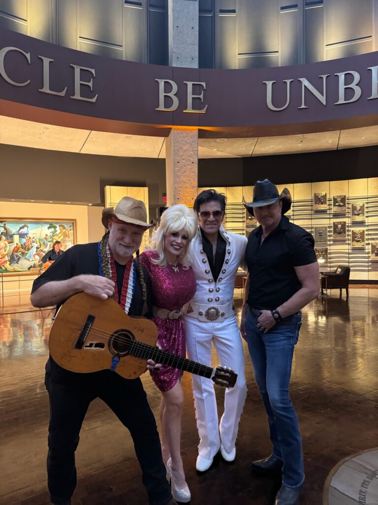 Country music singers posing in the Country Music Hall of Fame