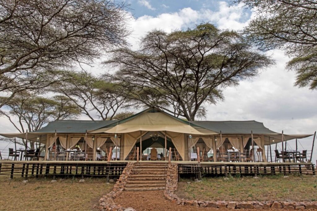 Luxury safari camp in Tanzania with elegant tents, stunning savannah views, and exclusive amenities, offering an immersive wildlife experience in East Africa’s premier safari destination.