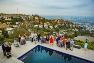 Attendees enjoying the view of Hollywood at a luxury estate