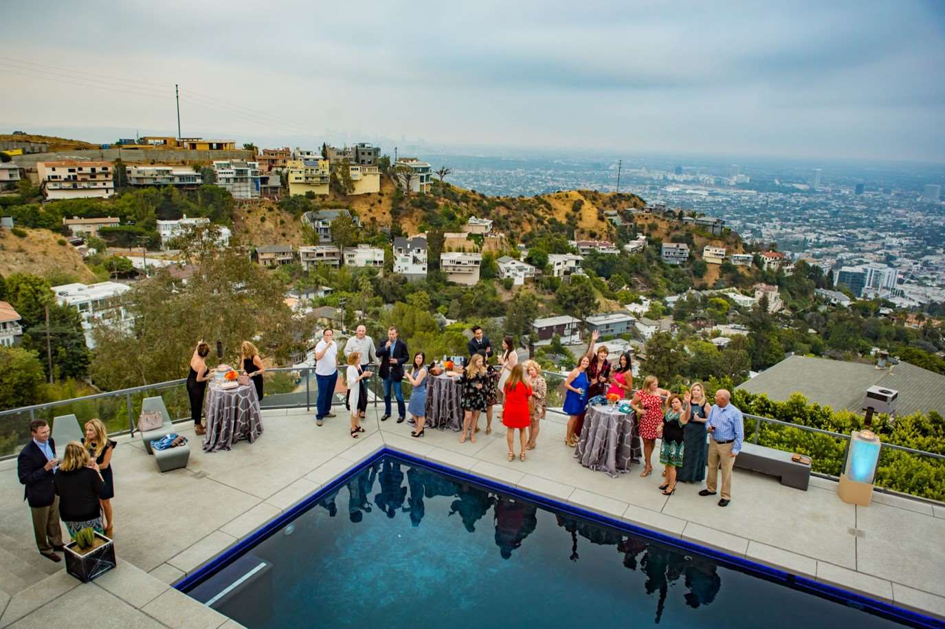 Attendees enjoying the view of Hollywood at a luxury estate