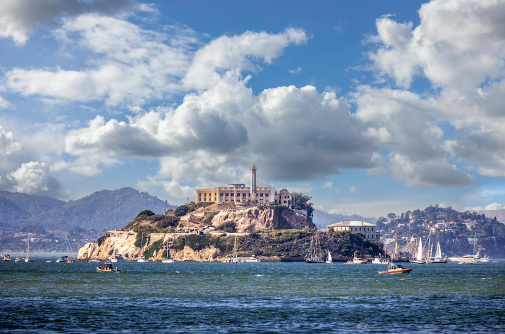 Alcatraz Island from the San Francisco Bay with sailboats in the water