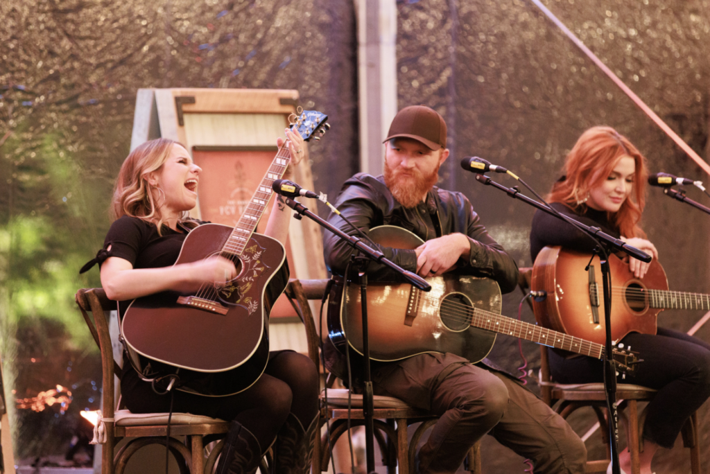 Trio of musicians playing the guitar