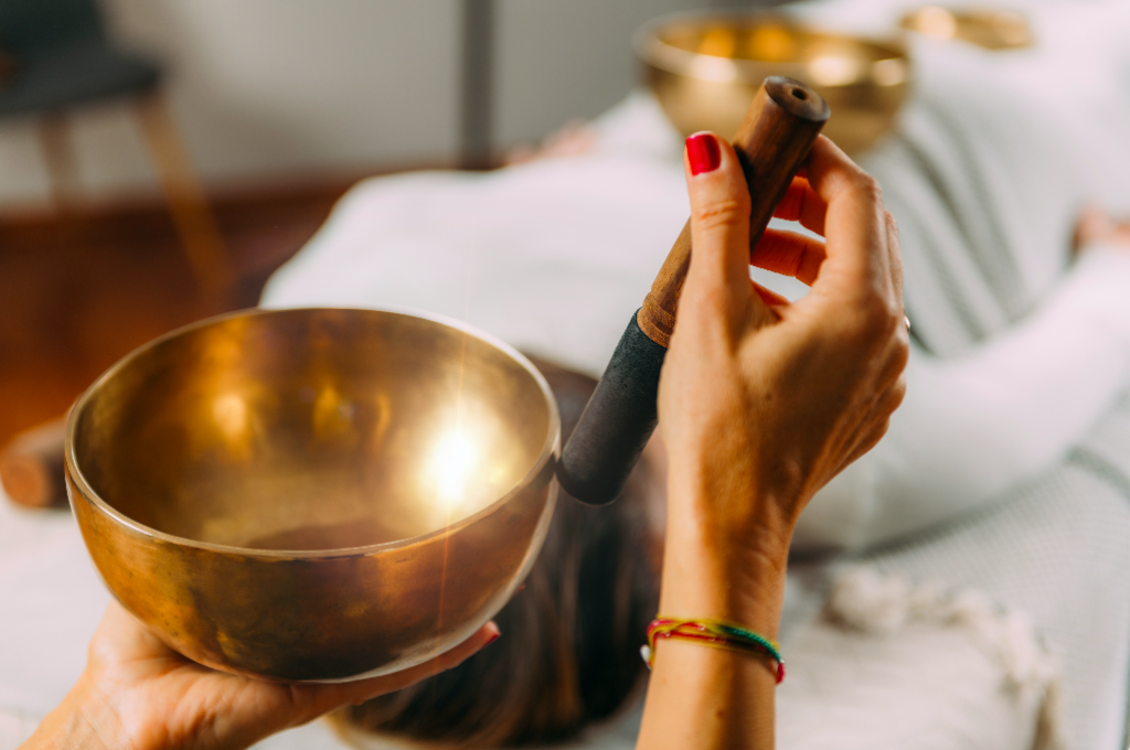 sound bowl with a woman's hand