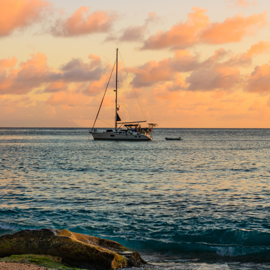 Boat sailing in the sunset