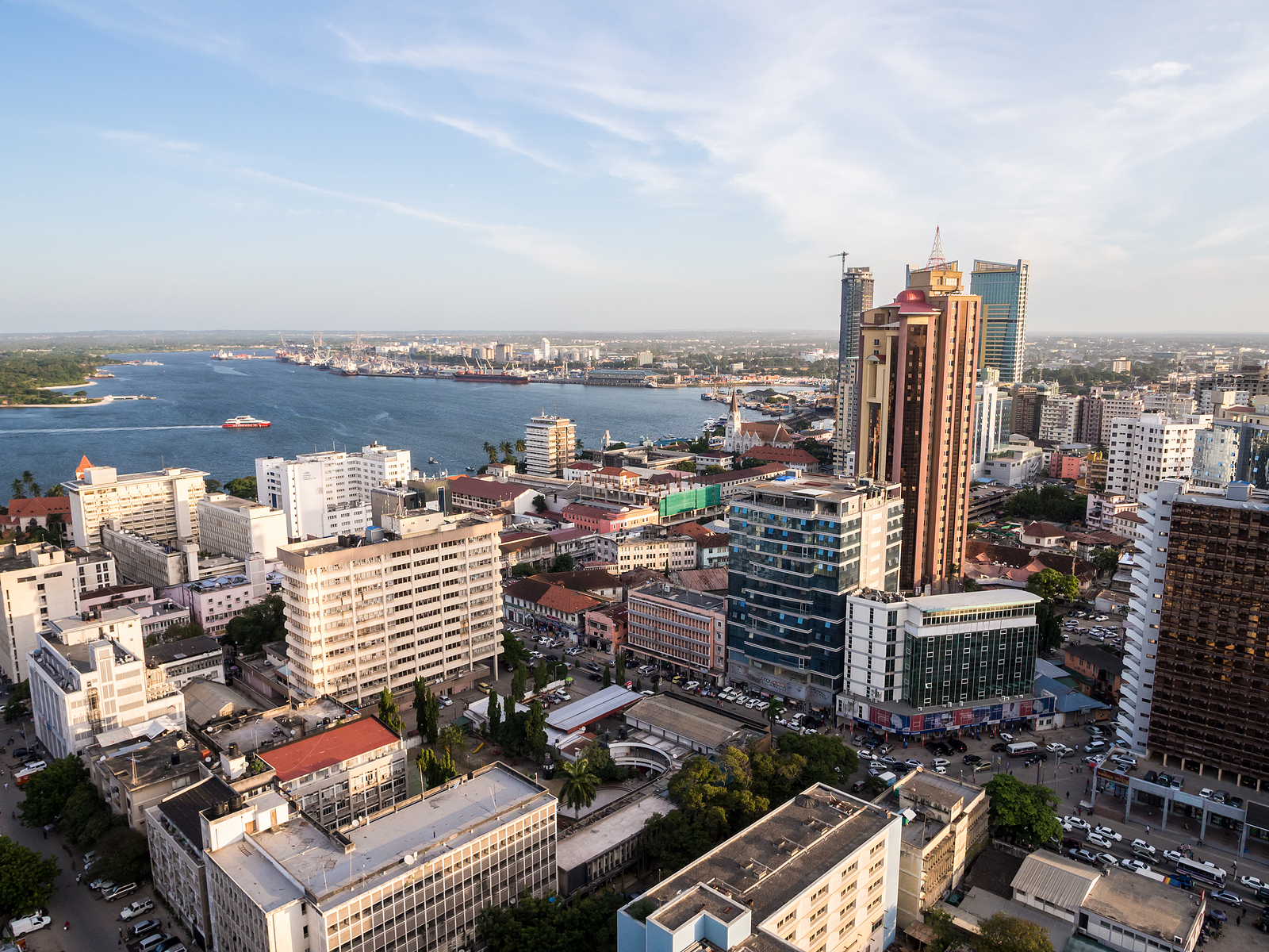 Aerial view of Dar es Salaam, Tanzania’s bustling coastal city, featuring modern architecture, beaches, and vibrant markets—a key East African destination for business, culture, and tourism.
