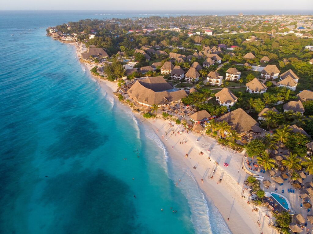 Beautiful beaches of Zanzibar, Tanzania, with white sand, turquoise waters, and palm trees, a top East African destination for luxury travel, cultural heritage, and island retreats.