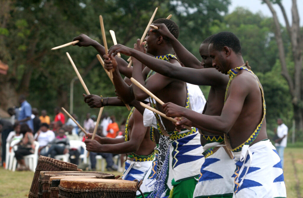 Traditional cultural dance in Rwanda, featuring vibrant costumes, rhythmic drumming, and energetic movements, showcasing Rwanda’s rich heritage and cultural celebrations in East Africa.