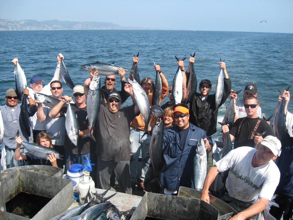 A group of people successfully deep-sea fishing in the pacific
