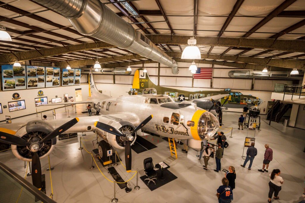 Inside the aircraft museum with planes and attendees
