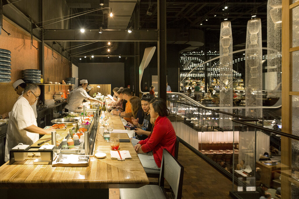 Group eating at a sushi bar