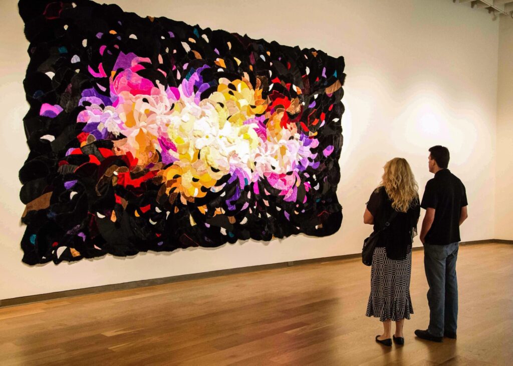 A couple viewing art at a museum