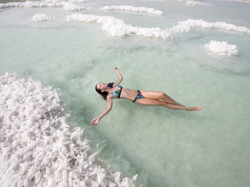 Woman floating in Dead Sea