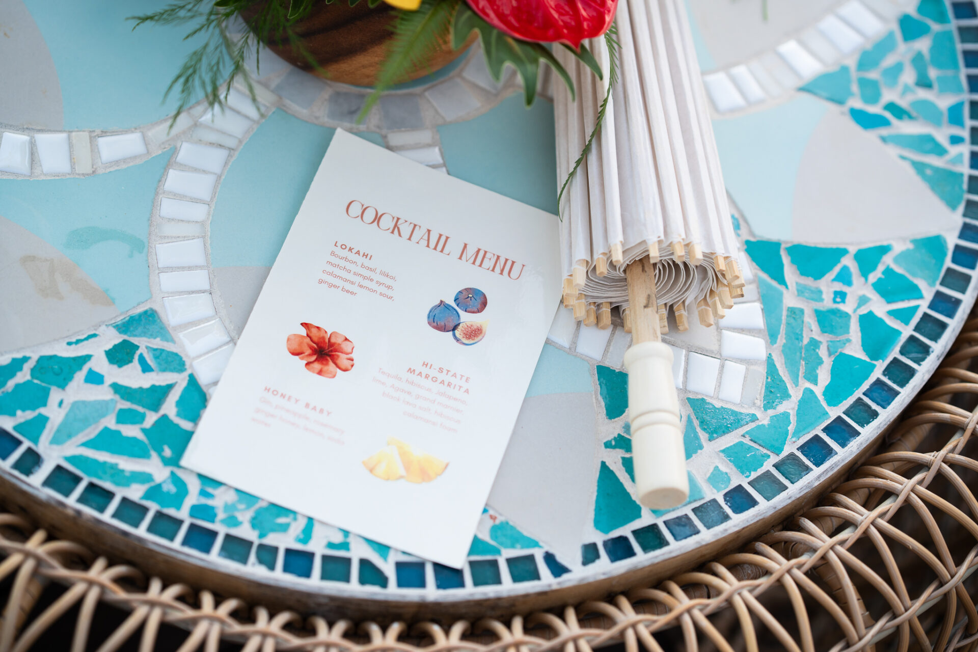 Colorful table setting with cocktail menu displayed