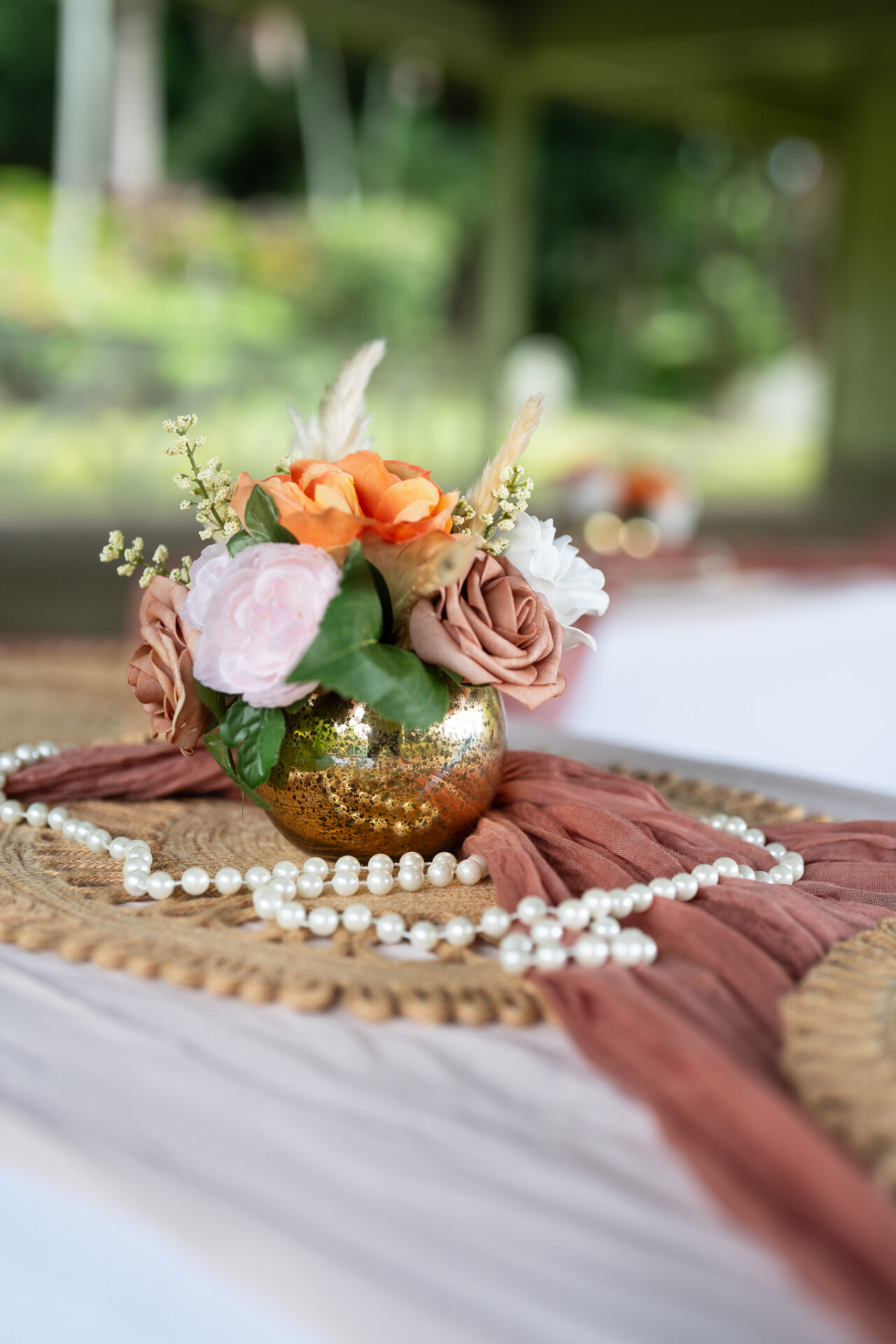 Table setting with flowers and pearls.