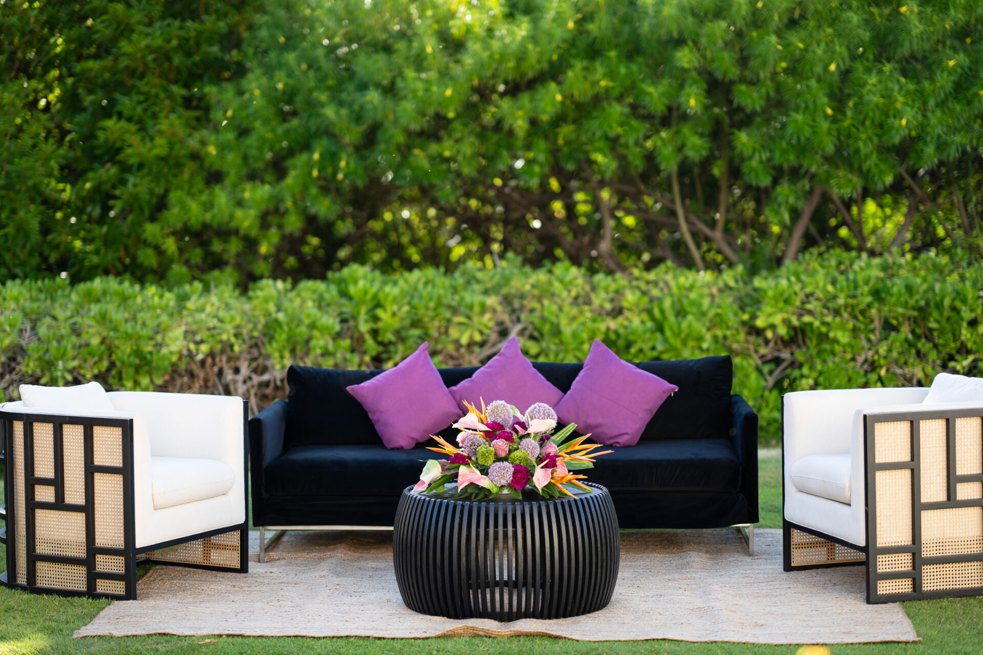 Three lounge seating in an outdoor garden setting.