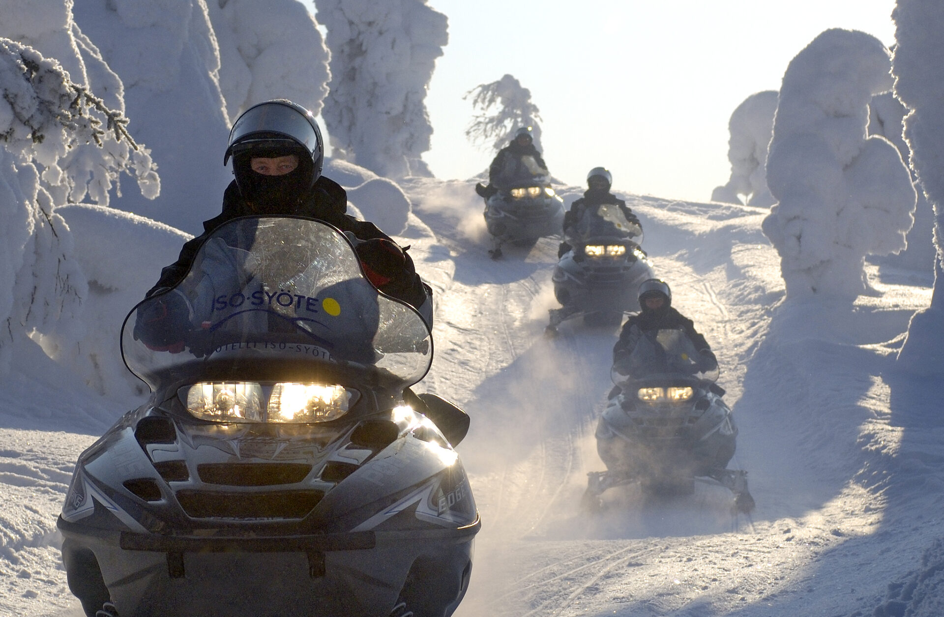 People riding a snowmobile