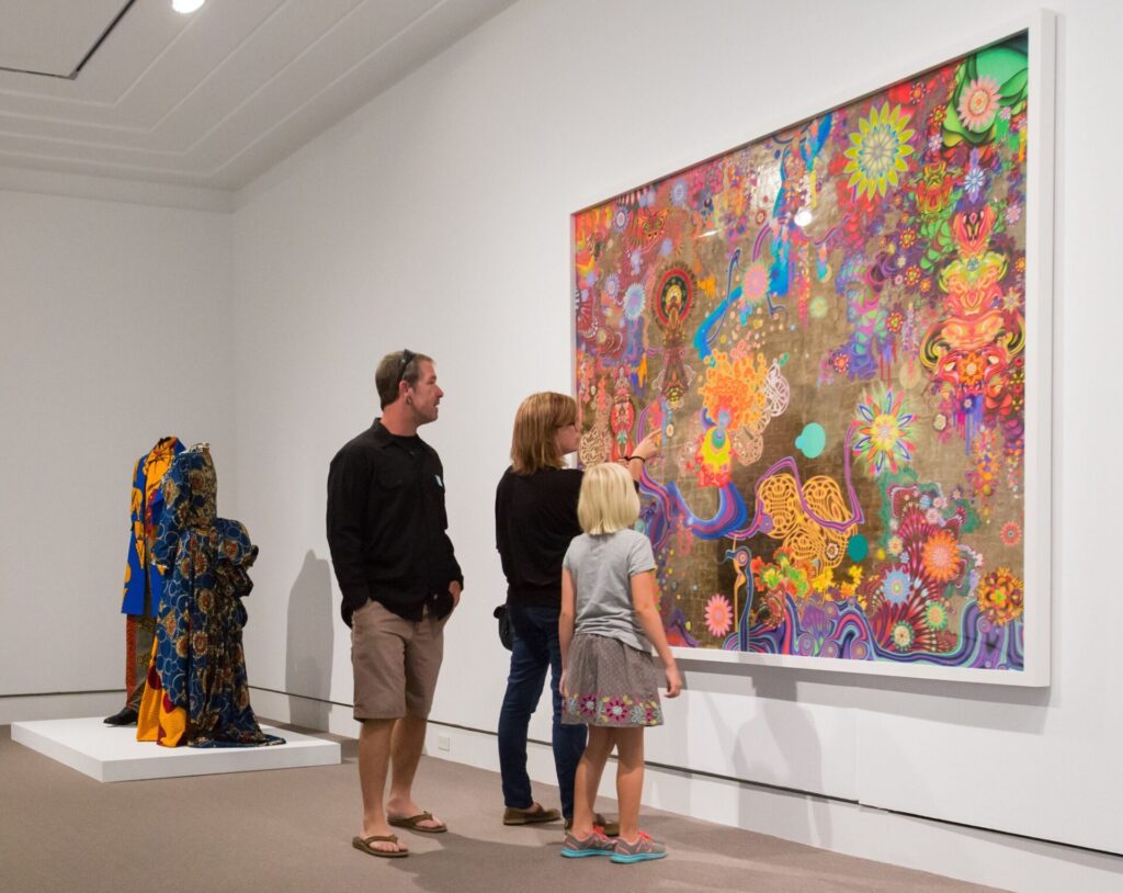 Family viewing art at the Norton Museum