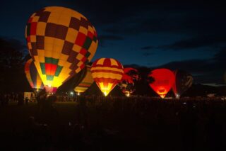 Colorful hot air balloons at night