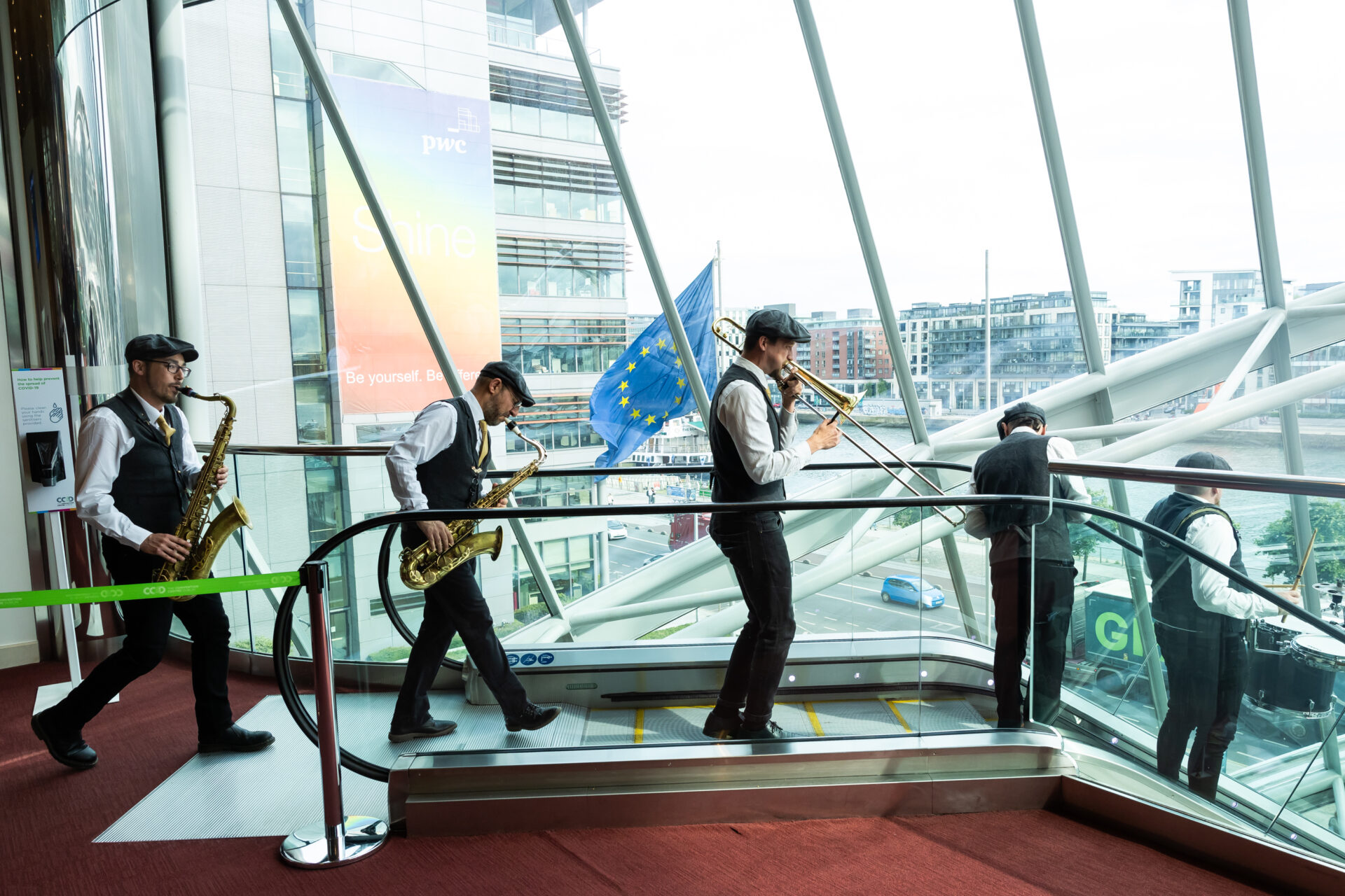 Band going down an escalator