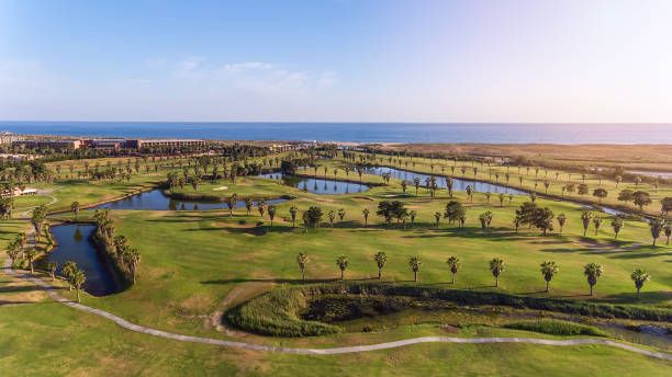 Aerial view of Green golf courses by the sea in Albufeira Portugal.